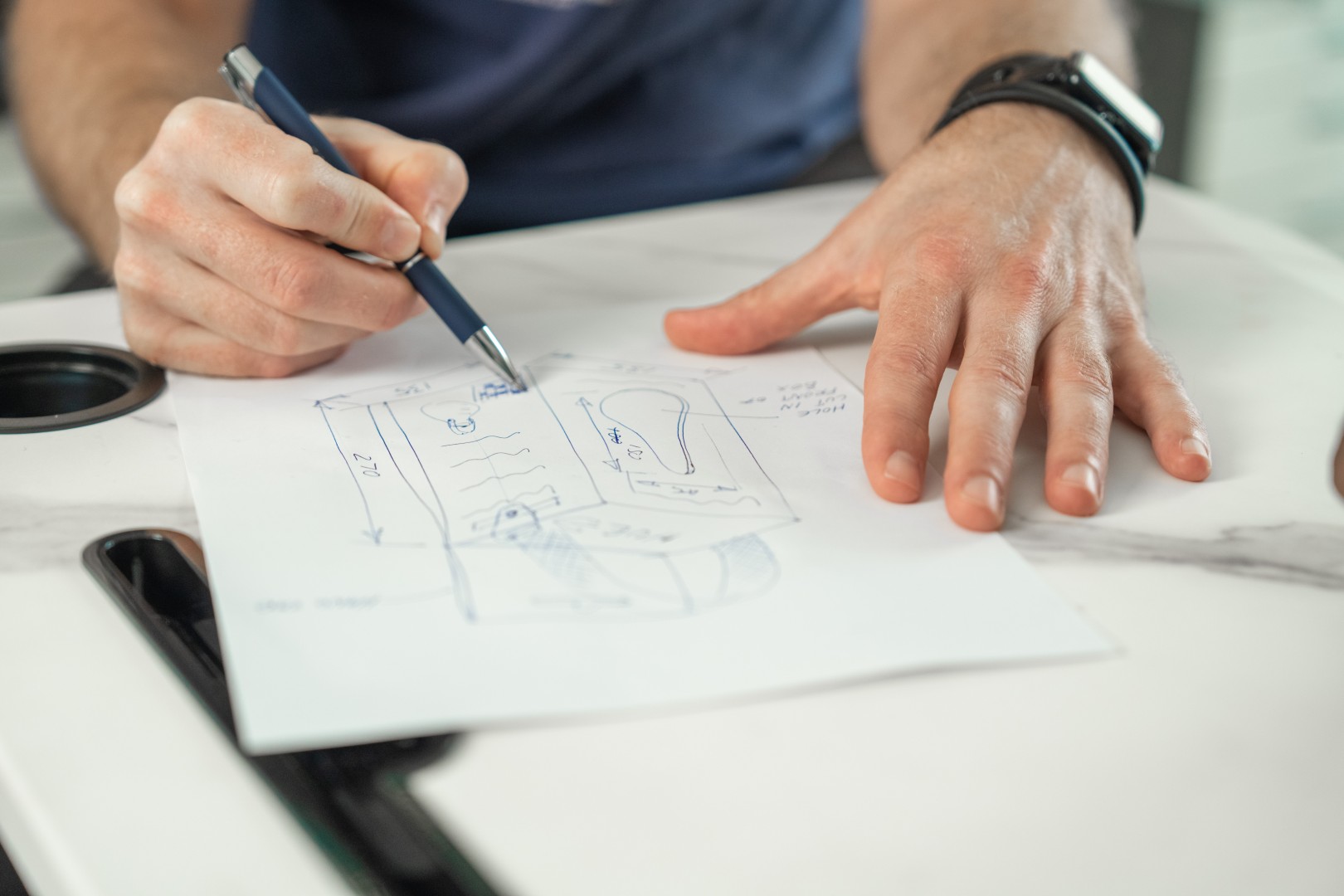 Pro-Dev industrial designer sketching product concepts — product design and manufacturing New Zealand