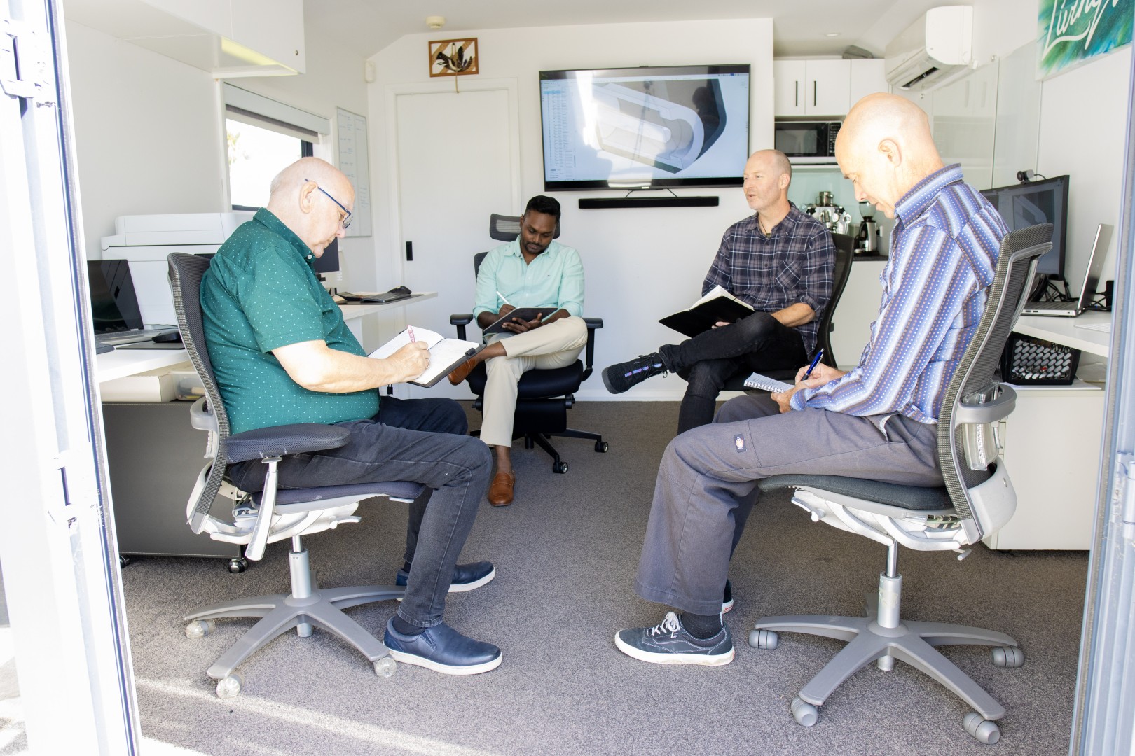 Pro-Dev team reviewing client project in Upper Hutt — product design and manufacturing New Zealand